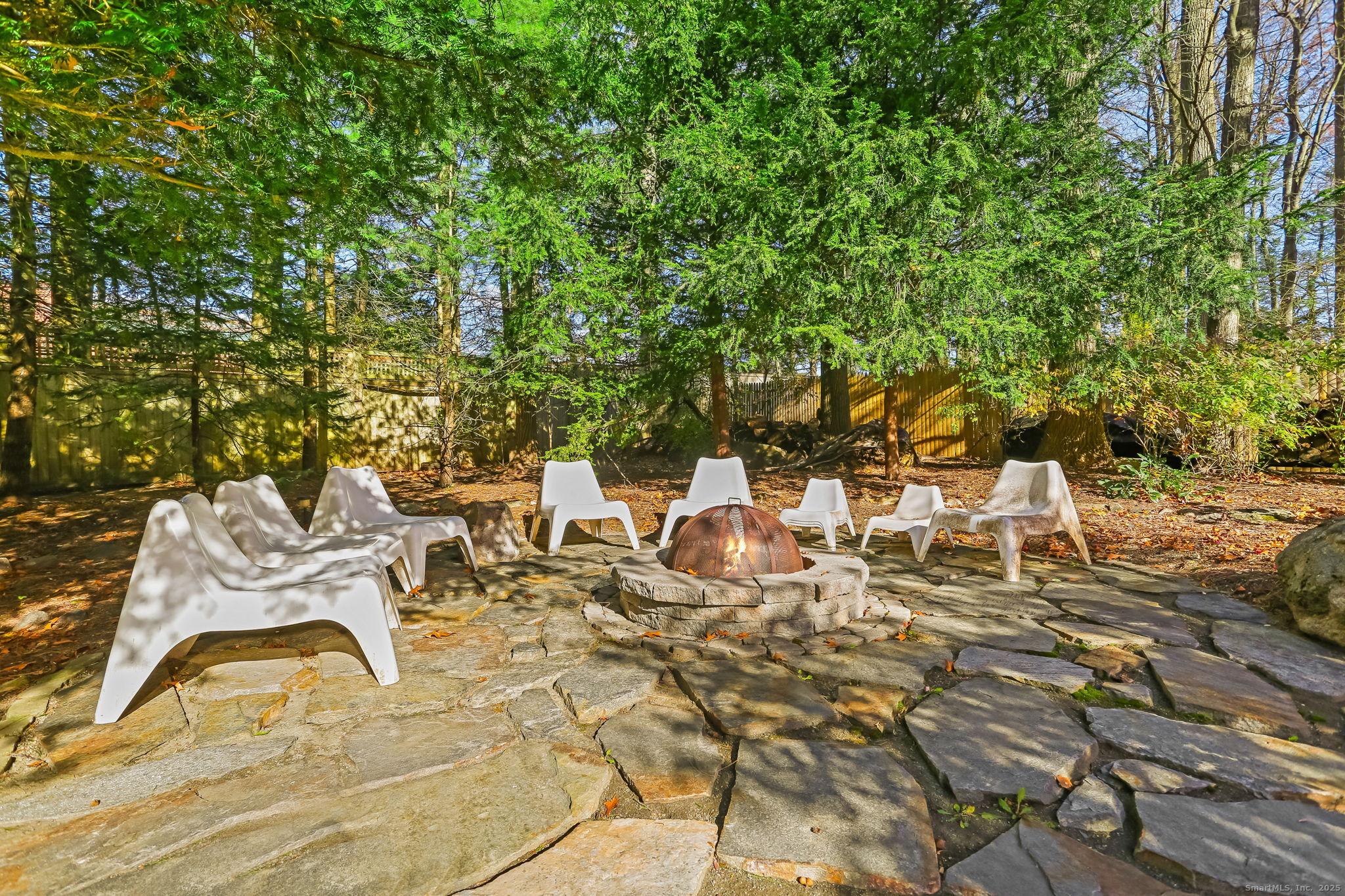 5 Willow Walk Road Westport, CT 06880 - Photo 37 of 40 a view of a lawn chairs and table of the patio