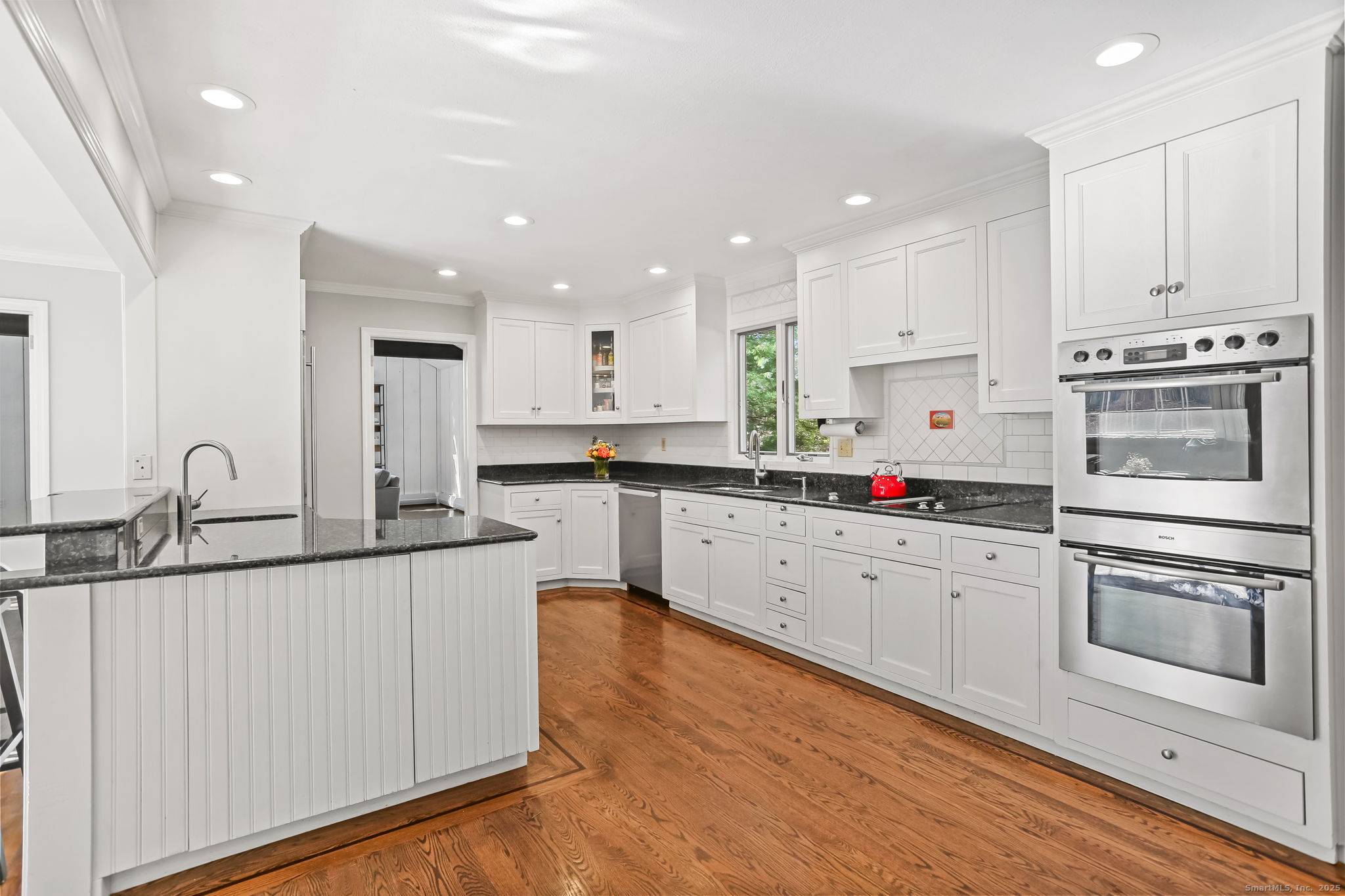 5 Willow Walk Road Westport, CT 06880 - Photo 9 of 40 a kitchen with stainless steel appliances granite countertop a sink and cabinets