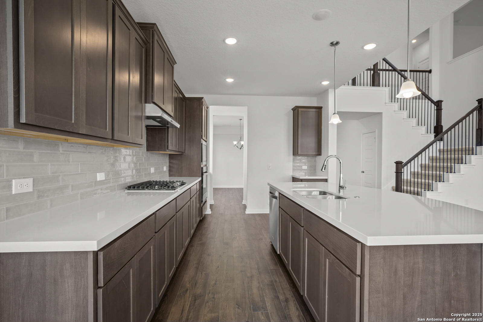 2804 Reeves Lane Schertz, TX 78108 - Photo 13 of 44 a kitchen with stainless steel appliances granite countertop plenty wooden cabinets and sink