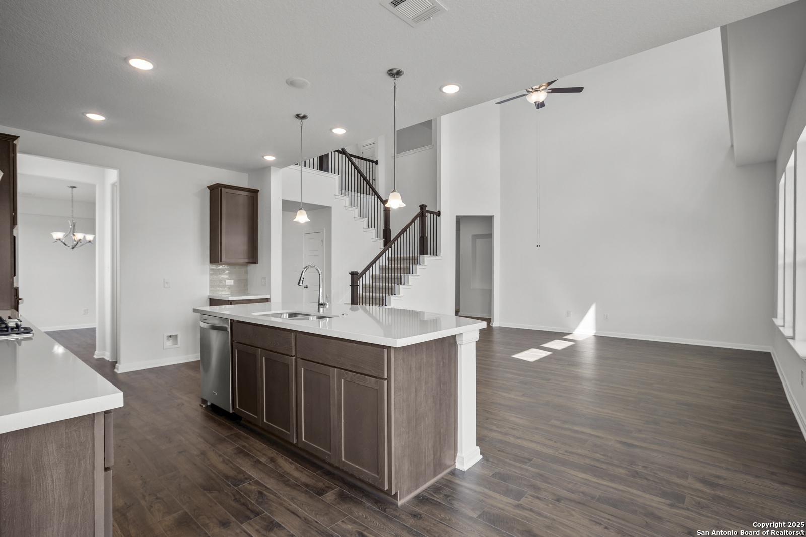 2804 Reeves Lane Schertz, TX 78108 - Photo 14 of 44 a kitchen with a stove and a wooden floor