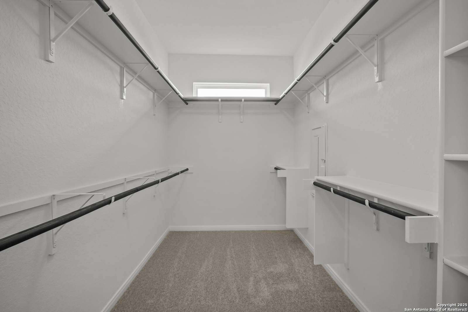 2804 Reeves Lane Schertz, TX 78108 - Photo 27 of 44 a view of a room with racks on the wall