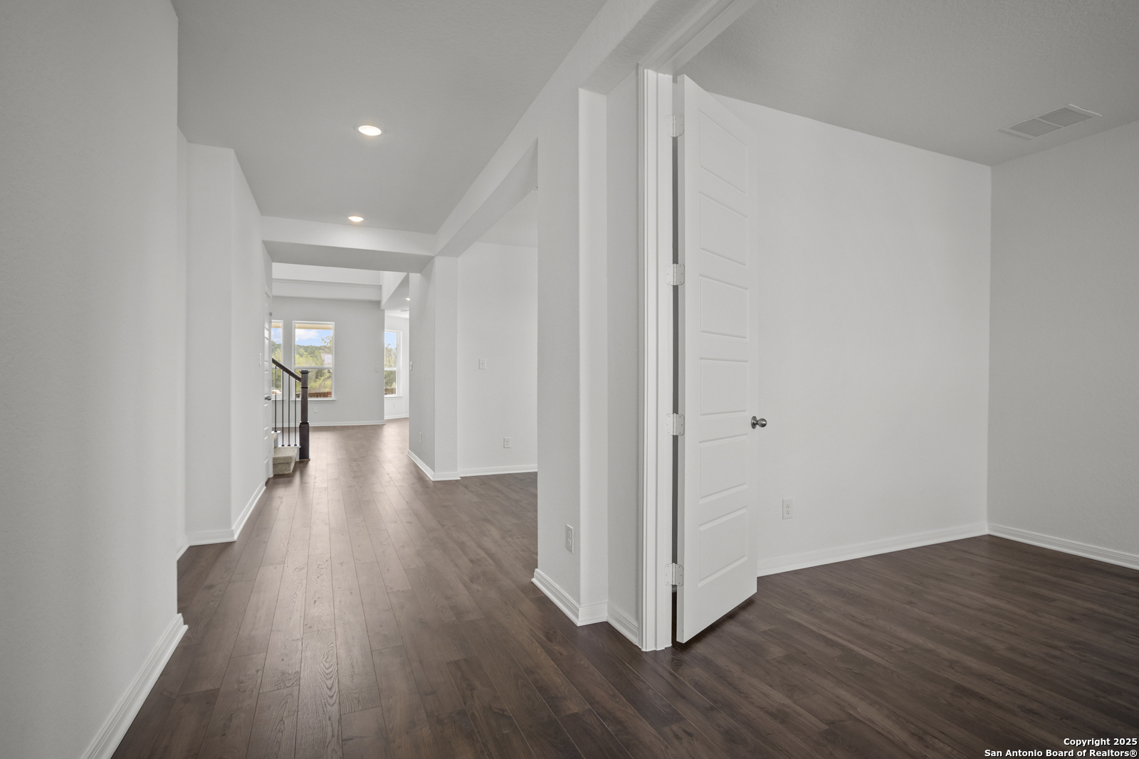 2804 Reeves Lane Schertz, TX 78108 - Photo 4 of 44 a view of a hallway with wooden floor