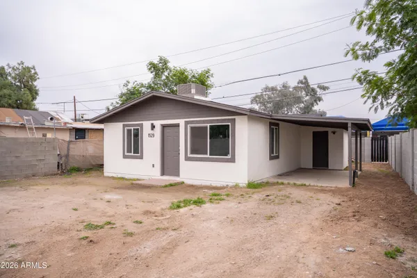 a view of a house with a house and a yard