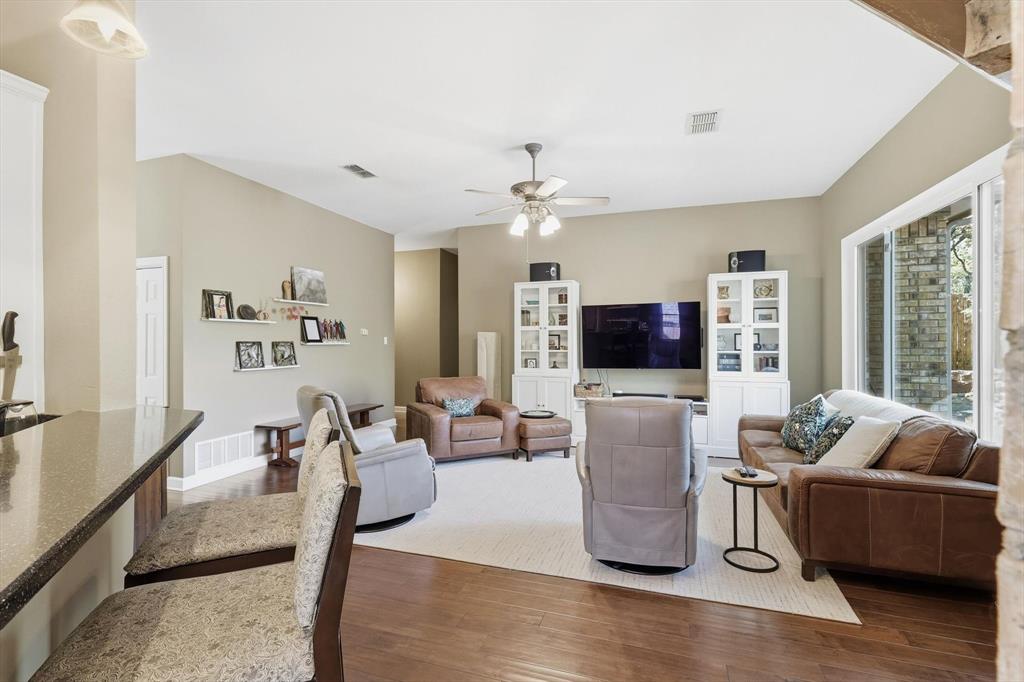 1311 Wilderness Street Denton, TX 76205 - Photo 13 of 40 a living room with furniture and a flat screen tv