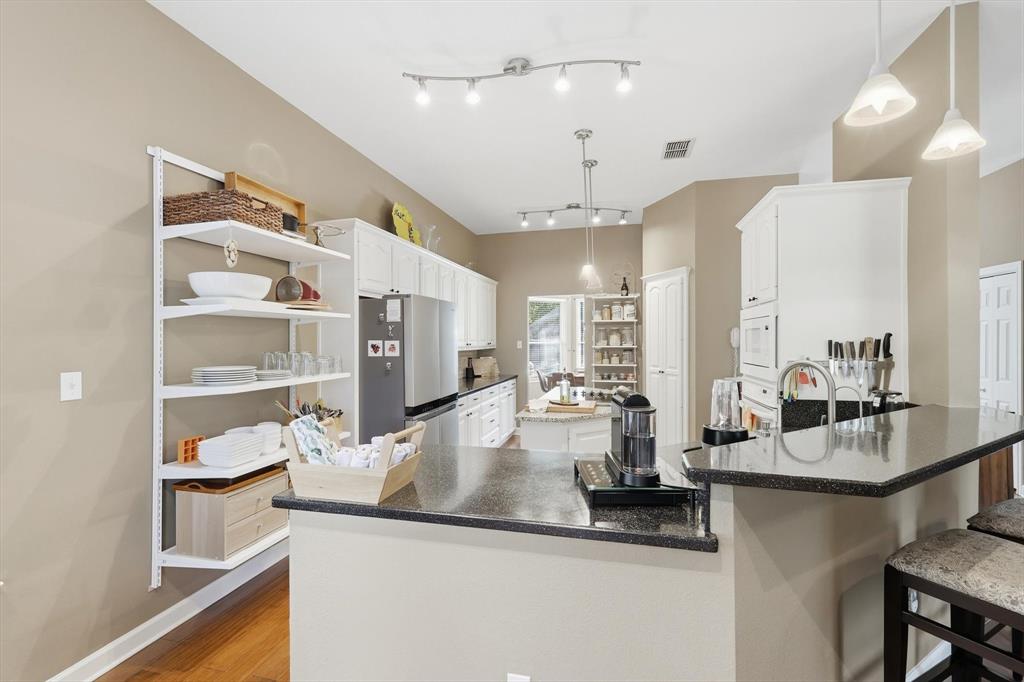 1311 Wilderness Street Denton, TX 76205 - Photo 19 of 40 a kitchen with counter top space and cabinets