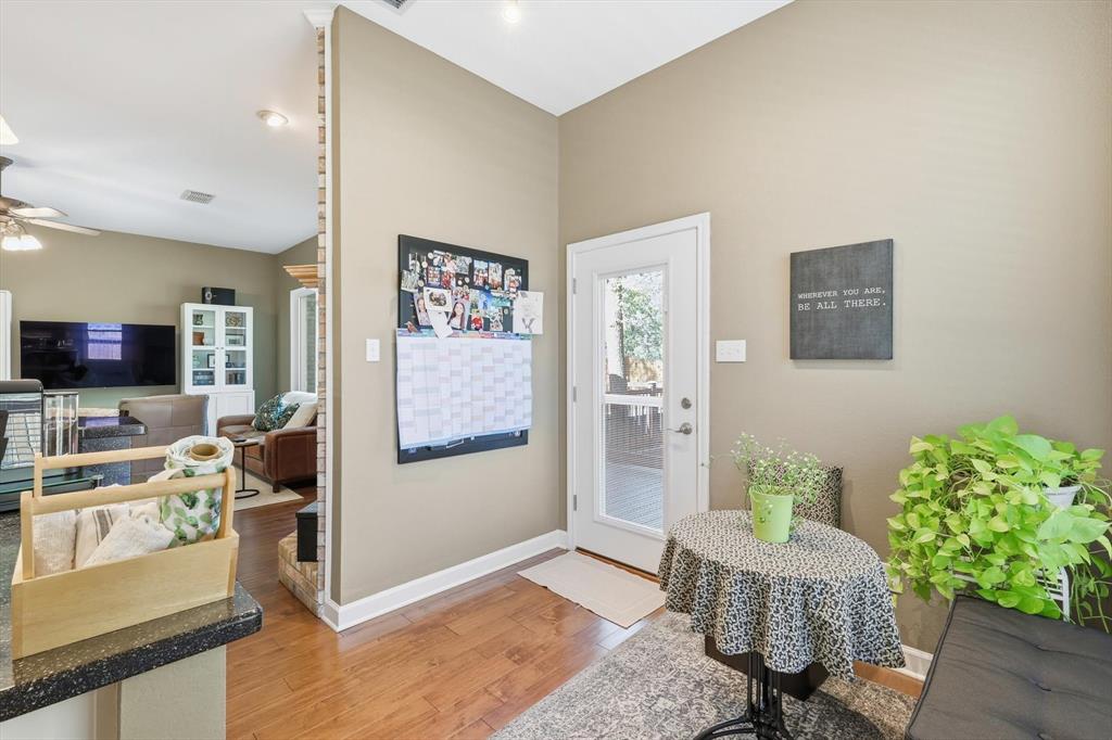 1311 Wilderness Street Denton, TX 76205 - Photo 20 of 40 a living room with furniture and a flat screen tv