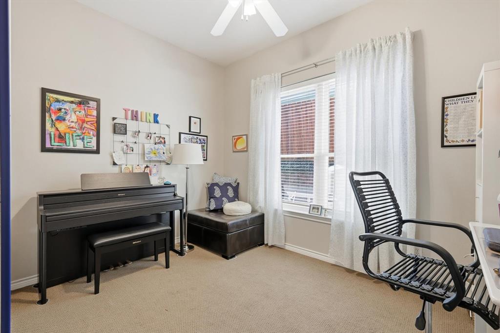 1311 Wilderness Street Denton, TX 76205 - Photo 27 of 40 a living room with furniture and a piano