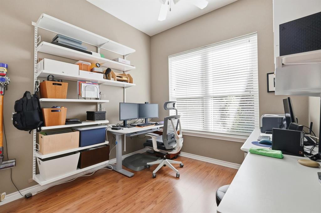 1311 Wilderness Street Denton, TX 76205 - Photo 31 of 40 a view of a workspace with furniture and a window