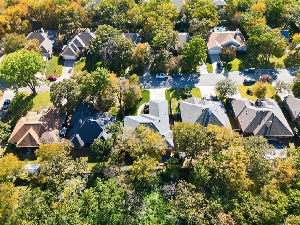 1311 Wilderness Street Denton, TX 76205 - Photo 39 of 40 a aerial view of a house with a yard and lake view