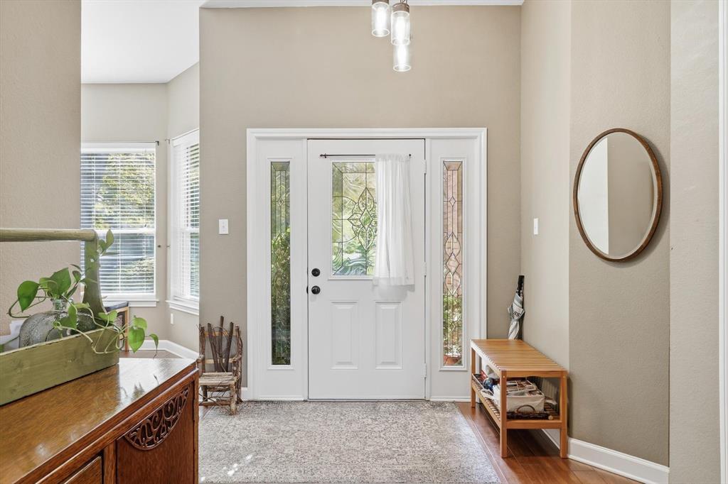 1311 Wilderness Street Denton, TX 76205 - Photo 4 of 40 a view of a room that has a bed and a window in it