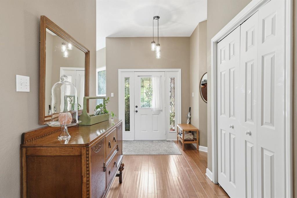 1311 Wilderness Street Denton, TX 76205 - Photo 9 of 40 a kitchen with a sink and a refrigerator