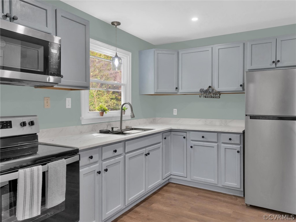 948 Barlen Drive Richmond, VA 23225 - Photo 3 of 12 a kitchen with stainless steel appliances granite countertop a sink stove and refrigerator