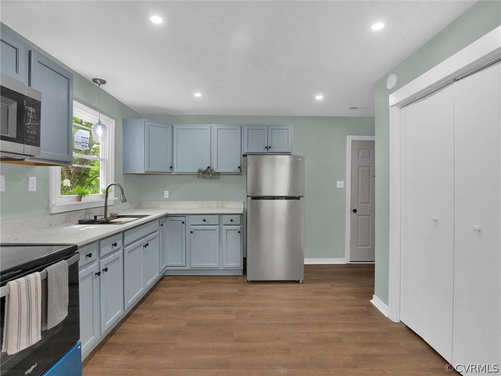948 Barlen Drive Richmond, VA 23225 - Photo 4 of 12 a kitchen with a refrigerator and a sink