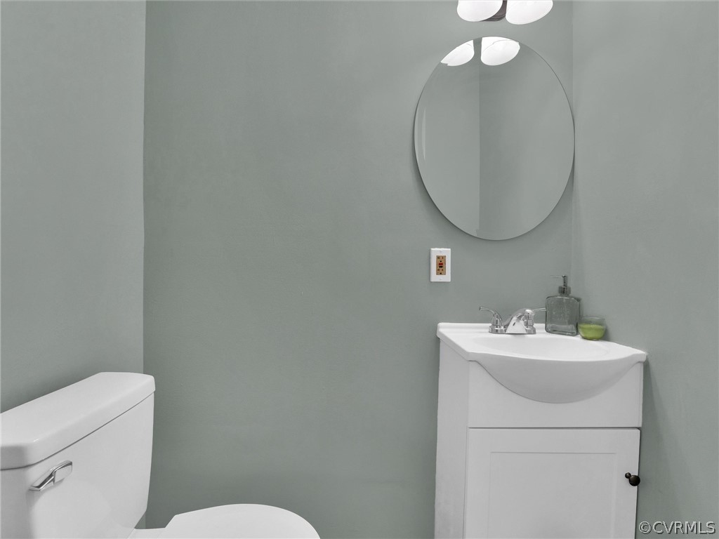948 Barlen Drive Richmond, VA 23225 - Photo 6 of 12 a bathroom with a sink mirror and toilet