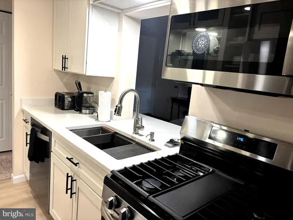 a kitchen with a stove and a microwave