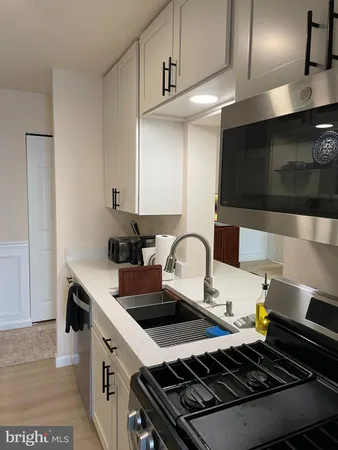 a kitchen with a stove and a microwave