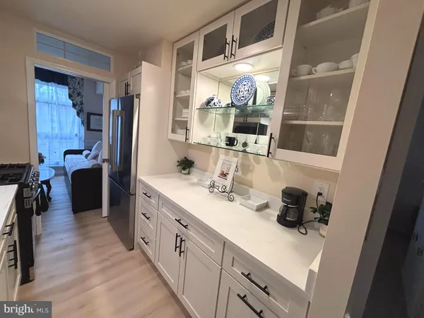 a kitchen with stainless steel appliances a sink stove and refrigerator