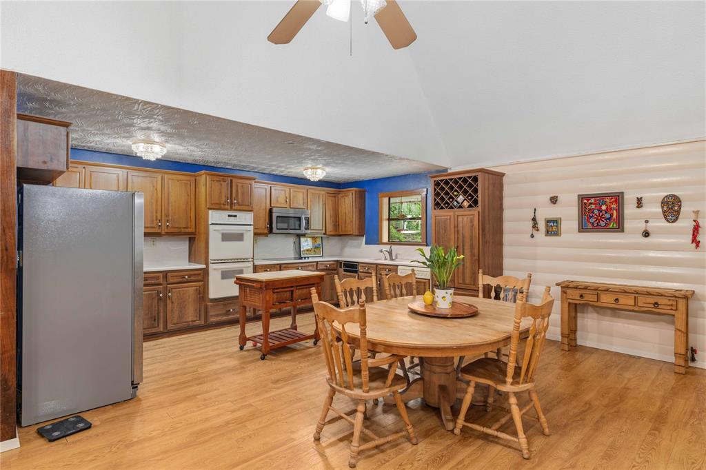 660 County Road 549 Mullin, TX 76864 - Photo 11 of 40 a view of a dining room with furniture and wooden floor