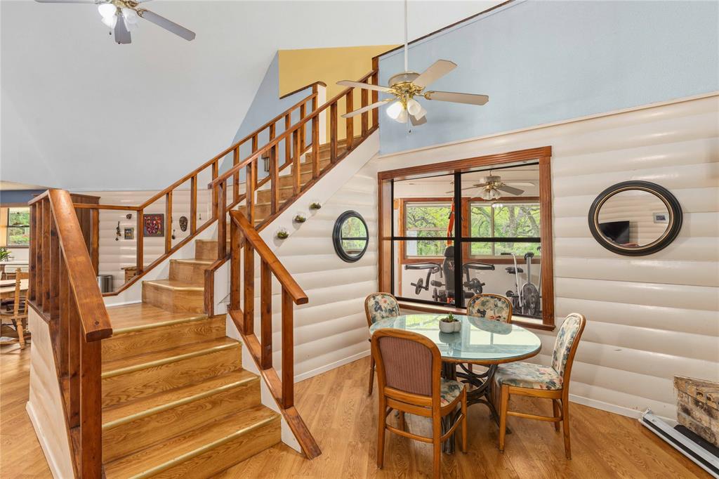 660 County Road 549 Mullin, TX 76864 - Photo 12 of 40 a view of a dining room with furniture wooden floor and a chandelier