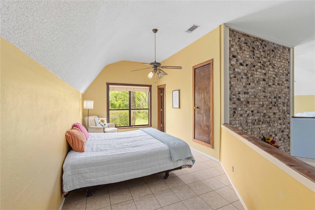 660 County Road 549 Mullin, TX 76864 - Photo 13 of 40 a bedroom with a bed and a window