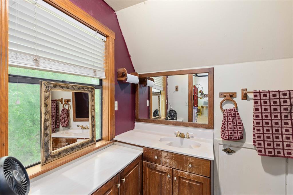 660 County Road 549 Mullin, TX 76864 - Photo 19 of 40 a bathroom with a sink and a mirror