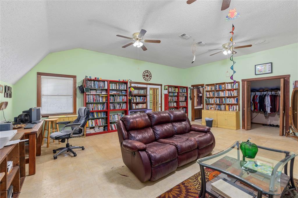 660 County Road 549 Mullin, TX 76864 - Photo 21 of 40 a work room with furniture and a book shelf