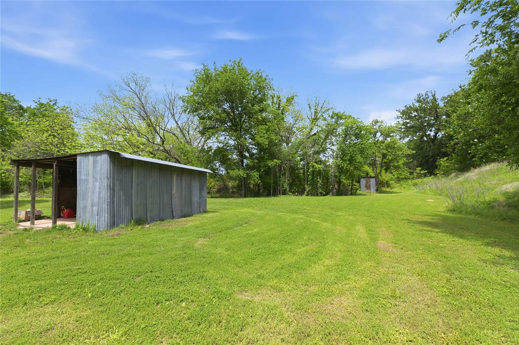 660 County Road 549 Mullin, TX 76864 - Photo 32 of 40 a backyard of a house with lots of green space