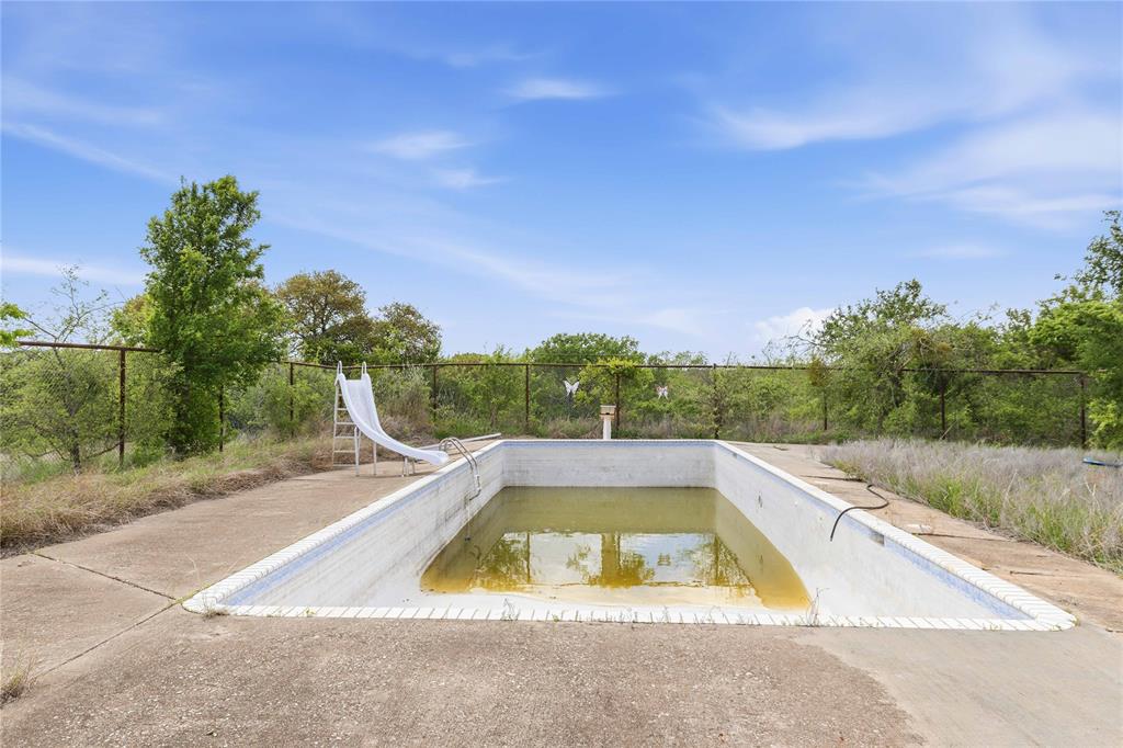 660 County Road 549 Mullin, TX 76864 - Photo 35 of 40 a view of a swimming pool with a yard
