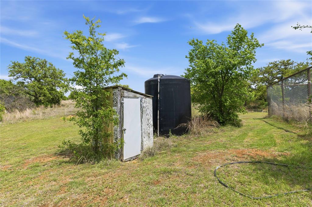 660 County Road 549 Mullin, TX 76864 - Photo 36 of 40 a backyard of a house with lots of green space