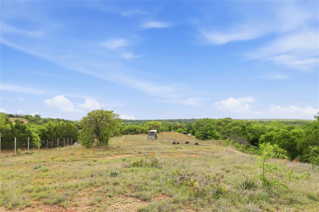 660 County Road 549 Mullin, TX 76864 - Photo 37 of 40 a view of a big yard with lots of green space and fog