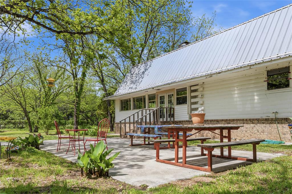 660 County Road 549 Mullin, TX 76864 - Photo 4 of 40 a view of a house with backyard and sitting area