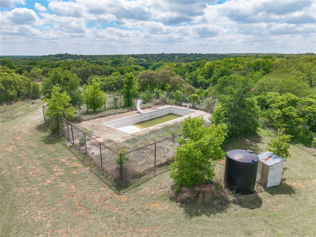 660 County Road 549 Mullin, TX 76864 - Photo 5 of 40 a view of a backyard with plants and a garden