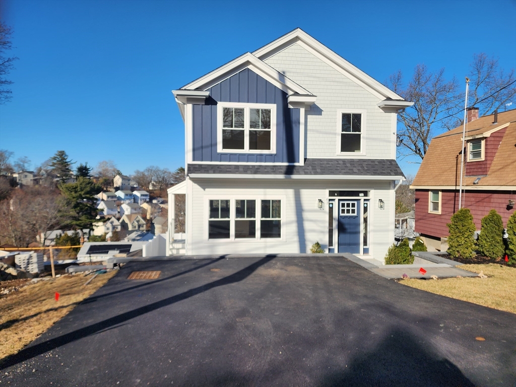 a view of a house with a street