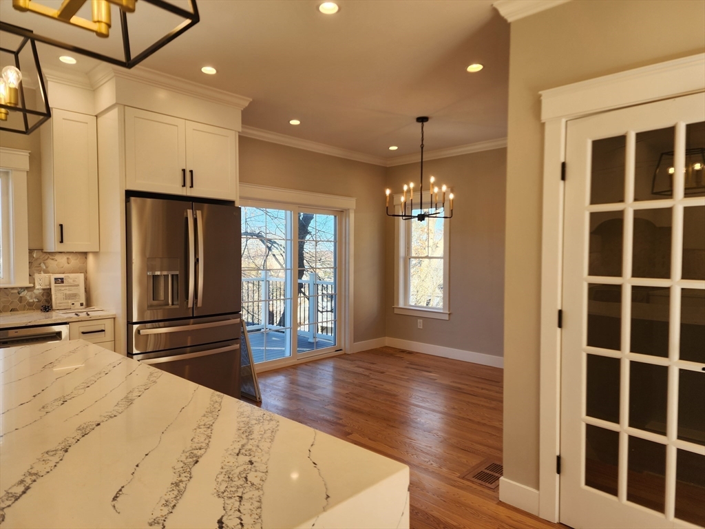 63 Montclair Avenue Waltham, MA 02451 - Photo 5 of 23 a spacious bathroom with a granite countertop sink a mirror and shower