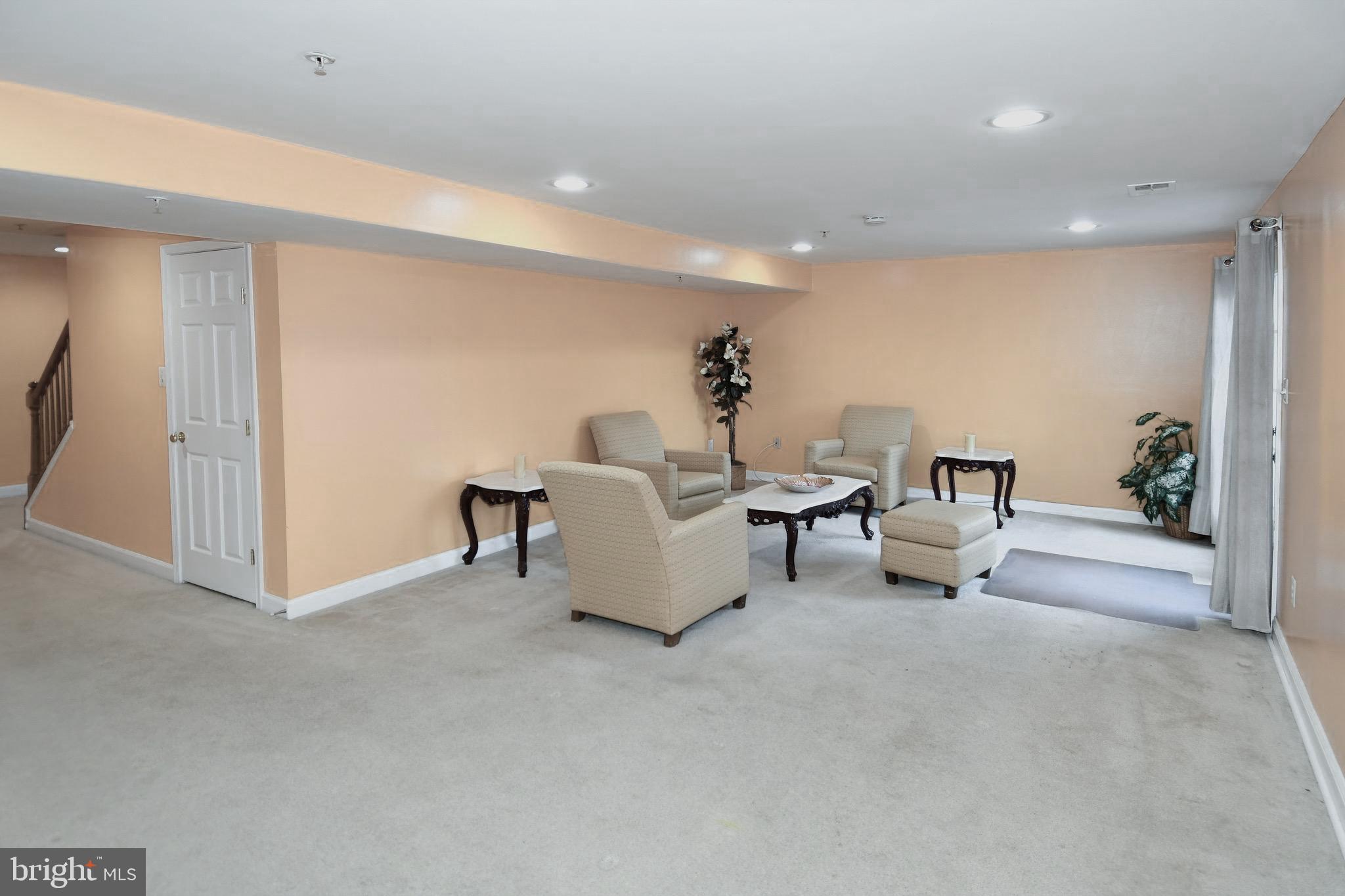 14528 Fairdale Road Silver Spring, MD 20905 - Photo 47 of 62 a living room with furniture and a potted plant