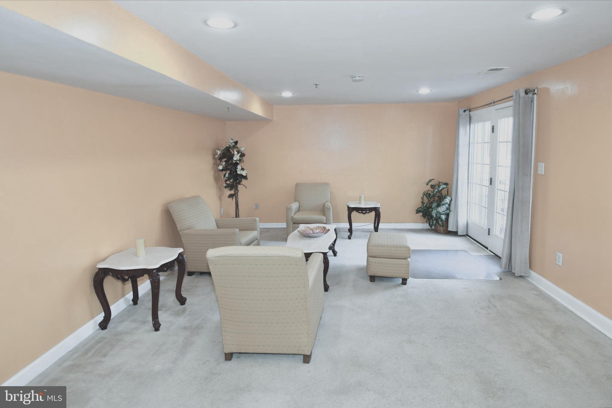 14528 Fairdale Road Silver Spring, MD 20905 - Photo 48 of 62 a living room with furniture and a potted plant