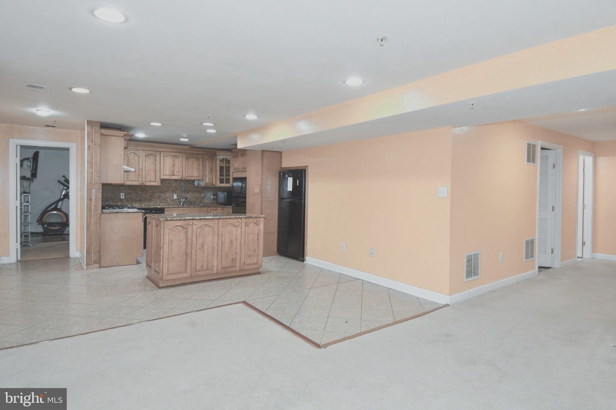 14528 Fairdale Road Silver Spring, MD 20905 - Photo 53 of 62 a view of kitchen with center island and stainless steel appliances