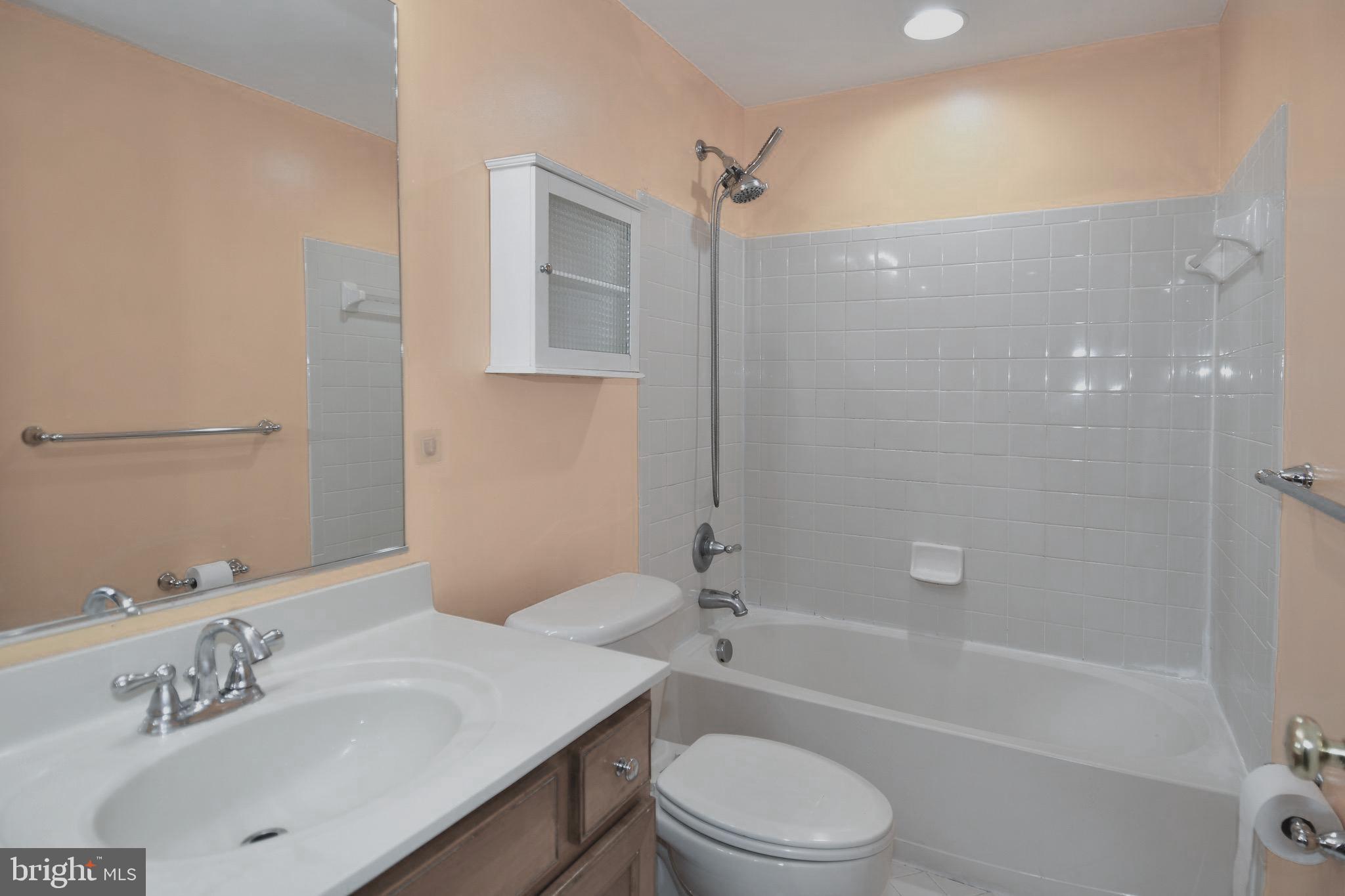 14528 Fairdale Road Silver Spring, MD 20905 - Photo 56 of 62 a bathroom with a sink a toilet and shower