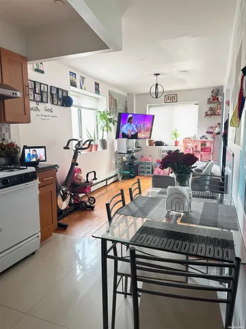 a view of a dining room with furniture and a chandelier