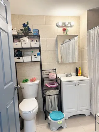 a bathroom with a sink toilet and vanity