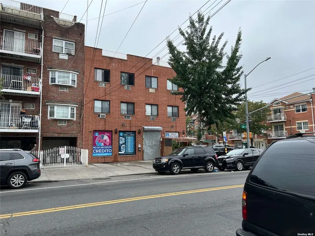 a view of a cars parked on the side of a street