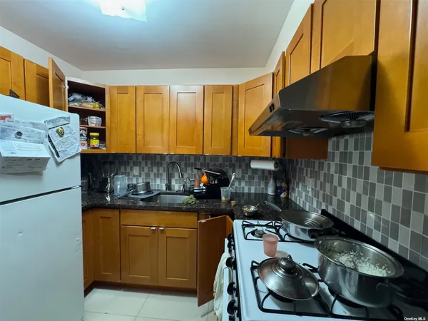 a kitchen that has a sink and a stove