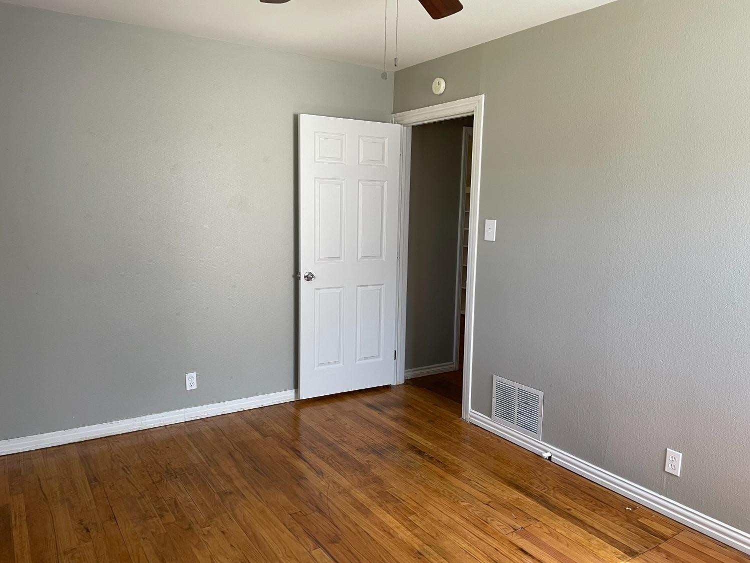 6501 Avenue T Lubbock, TX 79412 - Photo 16 of 20 a view of an empty room with wooden floor