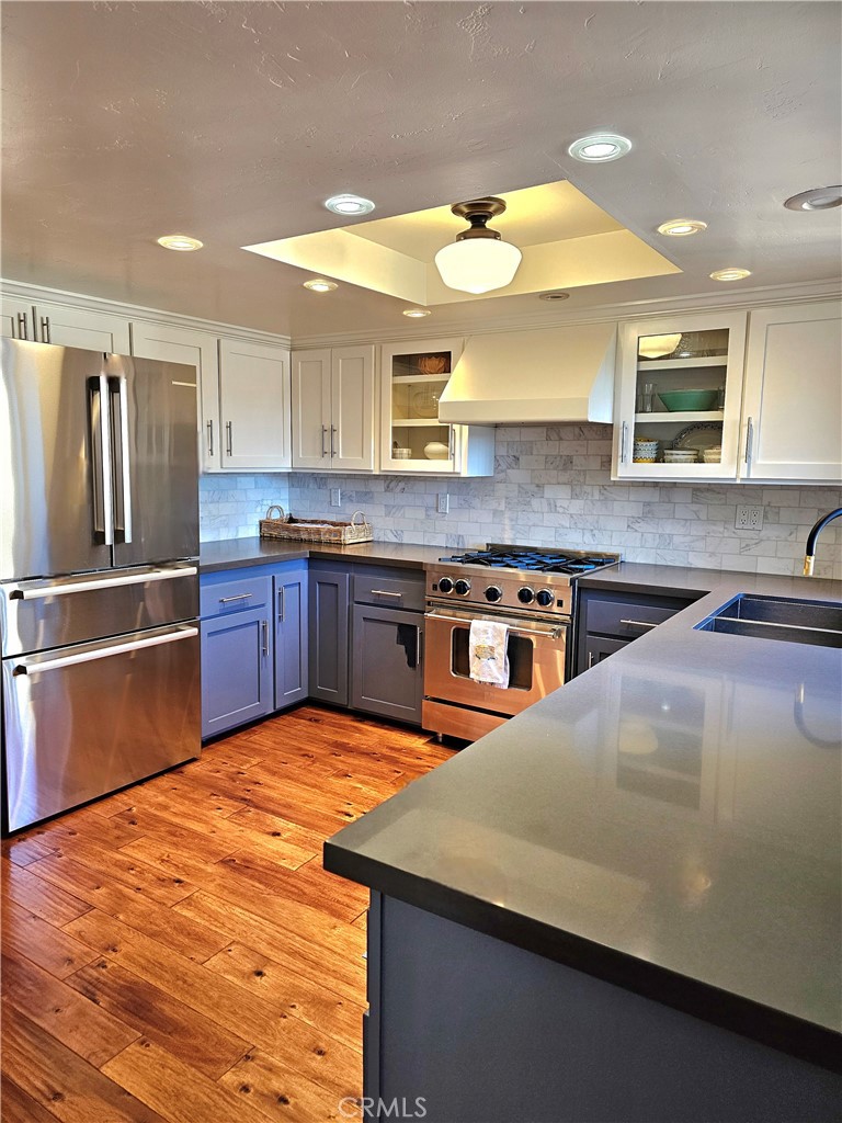 279 Tempus Circle Arroyo Grande, CA 93420 - Photo 11 of 38 a kitchen with stainless steel appliances granite countertop a sink and dishwasher