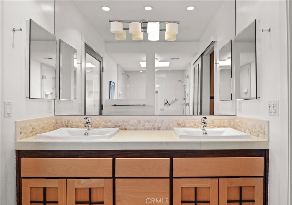 279 Tempus Circle Arroyo Grande, CA 93420 - Photo 15 of 38 a bathroom with a sink double vanity and a mirror