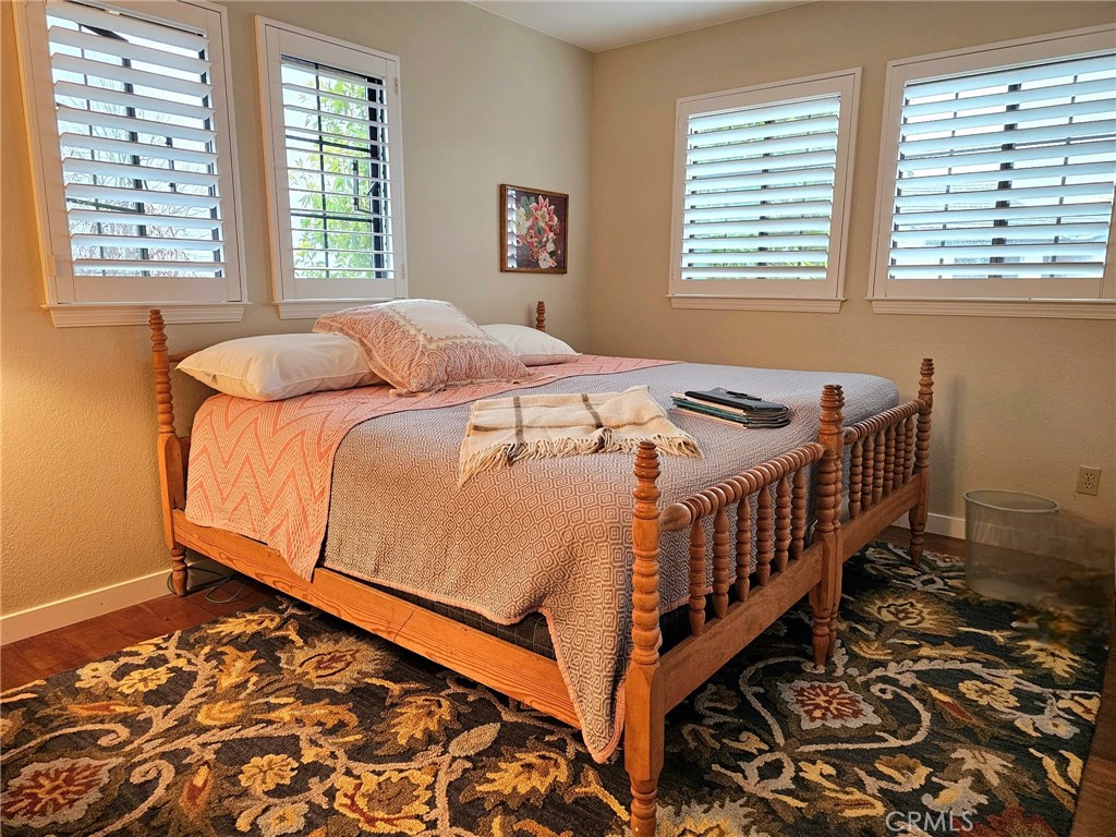 279 Tempus Circle Arroyo Grande, CA 93420 - Photo 20 of 38 a bedroom with a bed and window