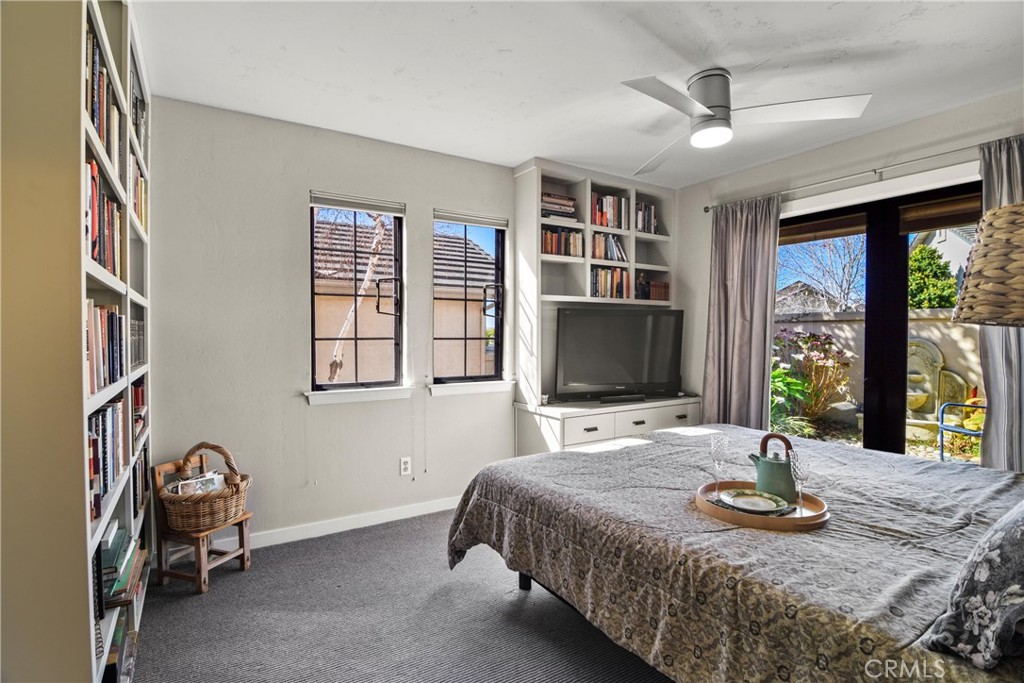 279 Tempus Circle Arroyo Grande, CA 93420 - Photo 27 of 38 a bedroom with a bed and a flat screen tv