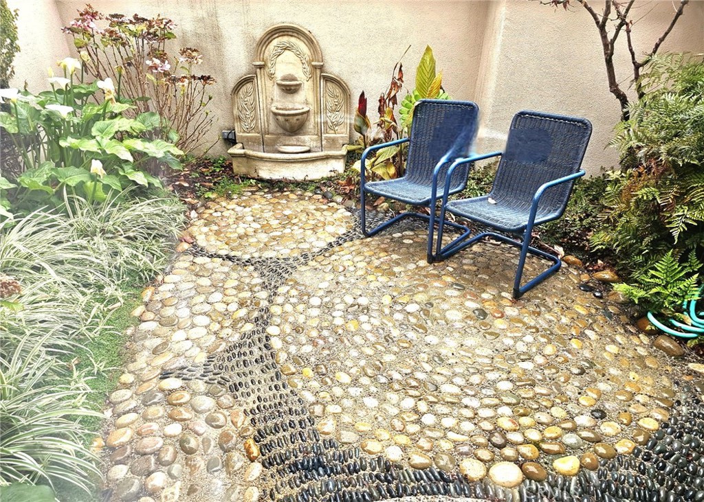 279 Tempus Circle Arroyo Grande, CA 93420 - Photo 30 of 38 a blue chair sitting in a backyard of a house