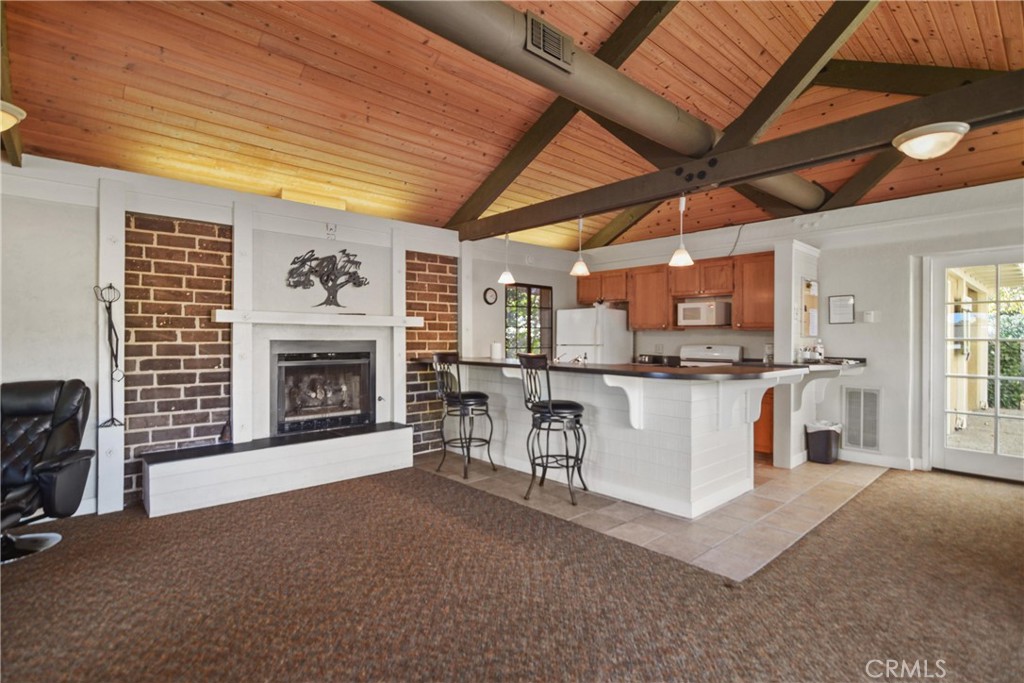 279 Tempus Circle Arroyo Grande, CA 93420 - Photo 37 of 38 a view of kitchen with furniture and fireplace
