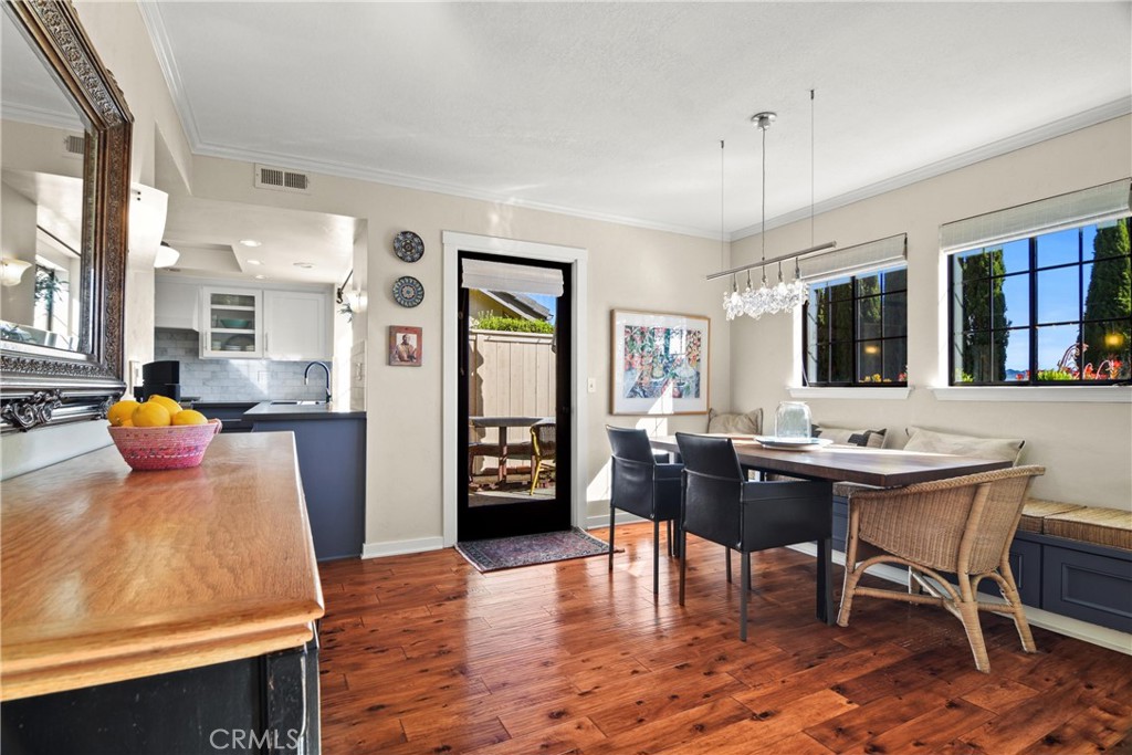 279 Tempus Circle Arroyo Grande, CA 93420 - Photo 7 of 38 a view of a dining room with furniture and wooden floor